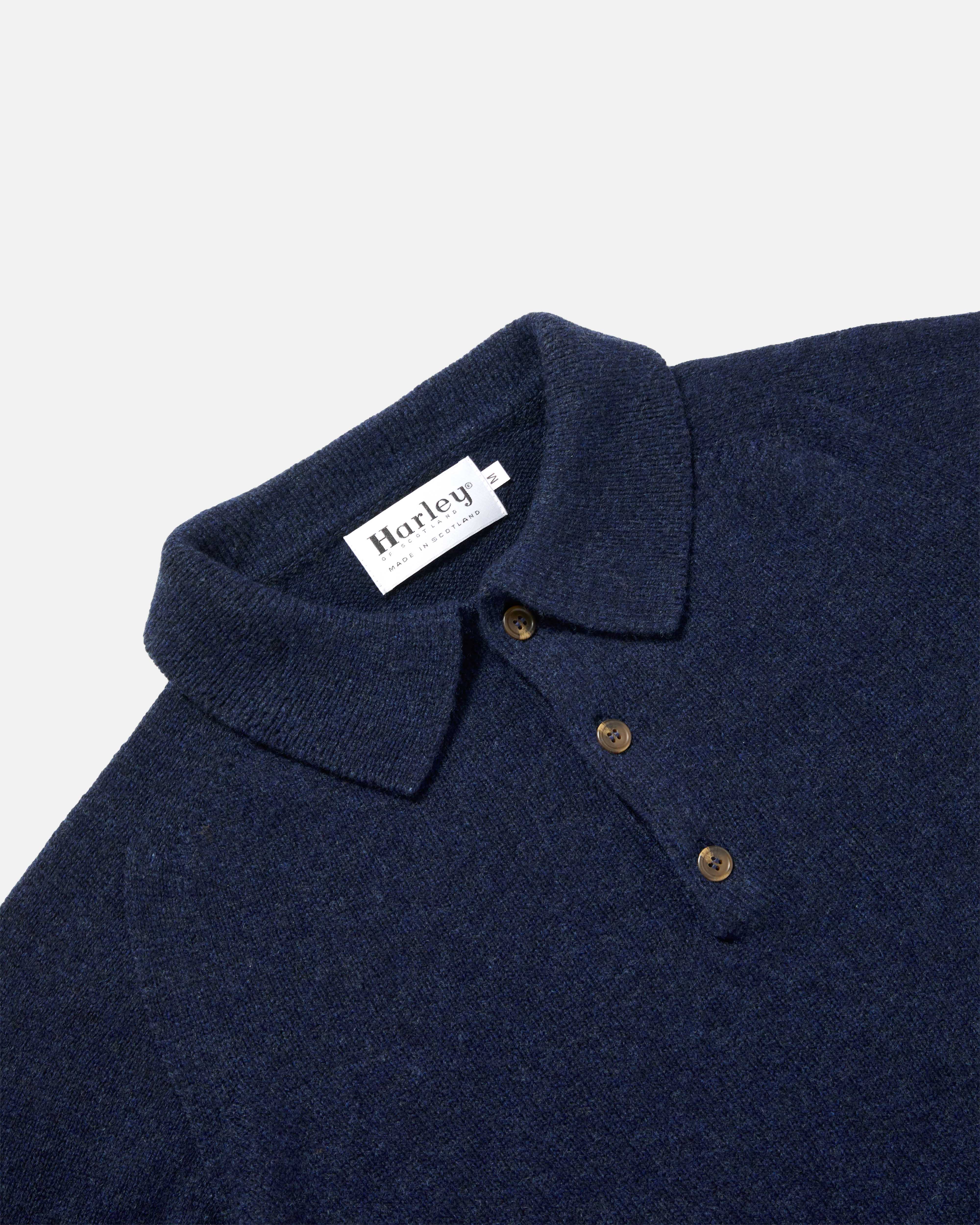 Close-up of collar and button detail on navy Harley Superfine Lambswool Polo