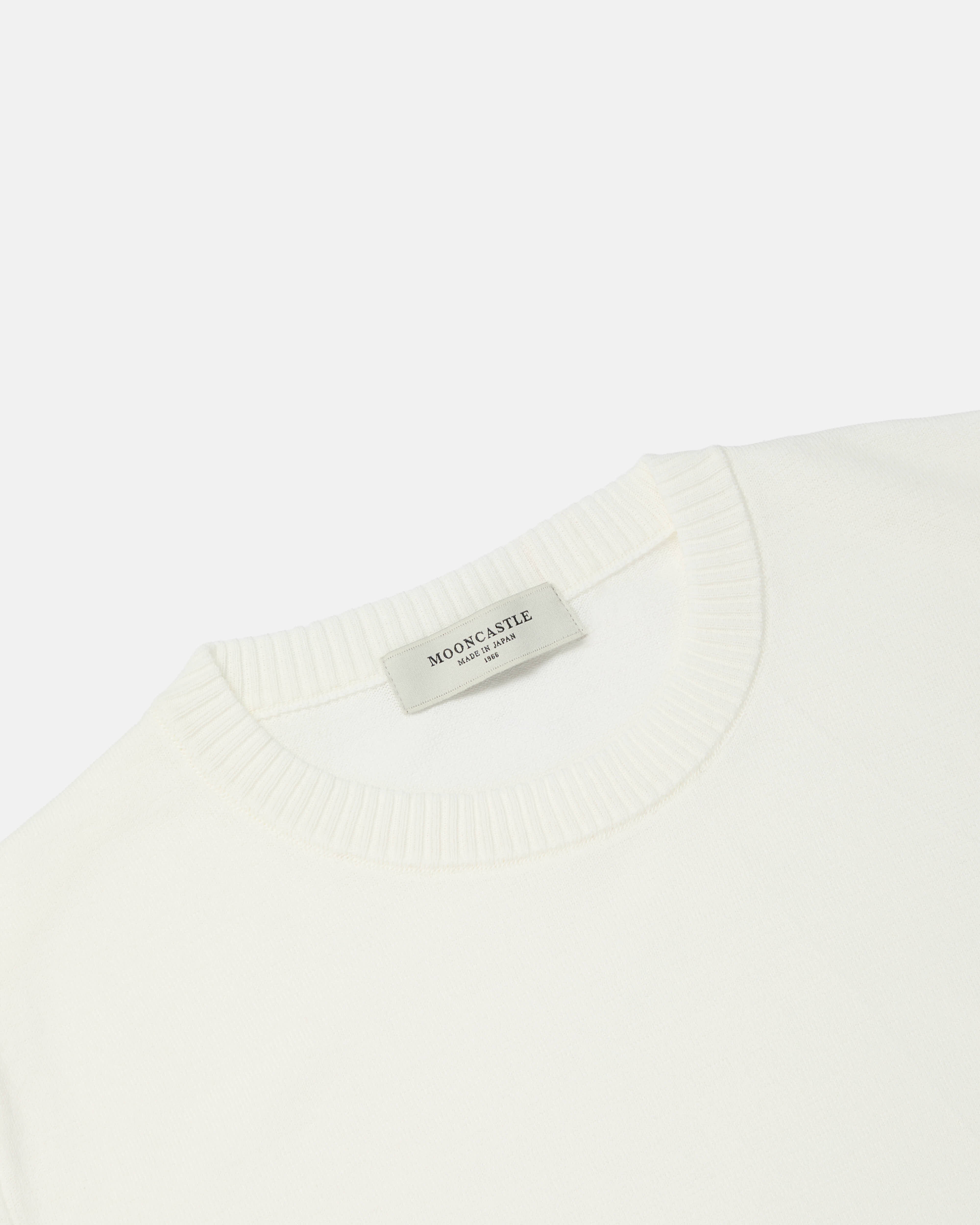 Close-up of crewneck collar on off-white Mooncastle Ice Cotton tee