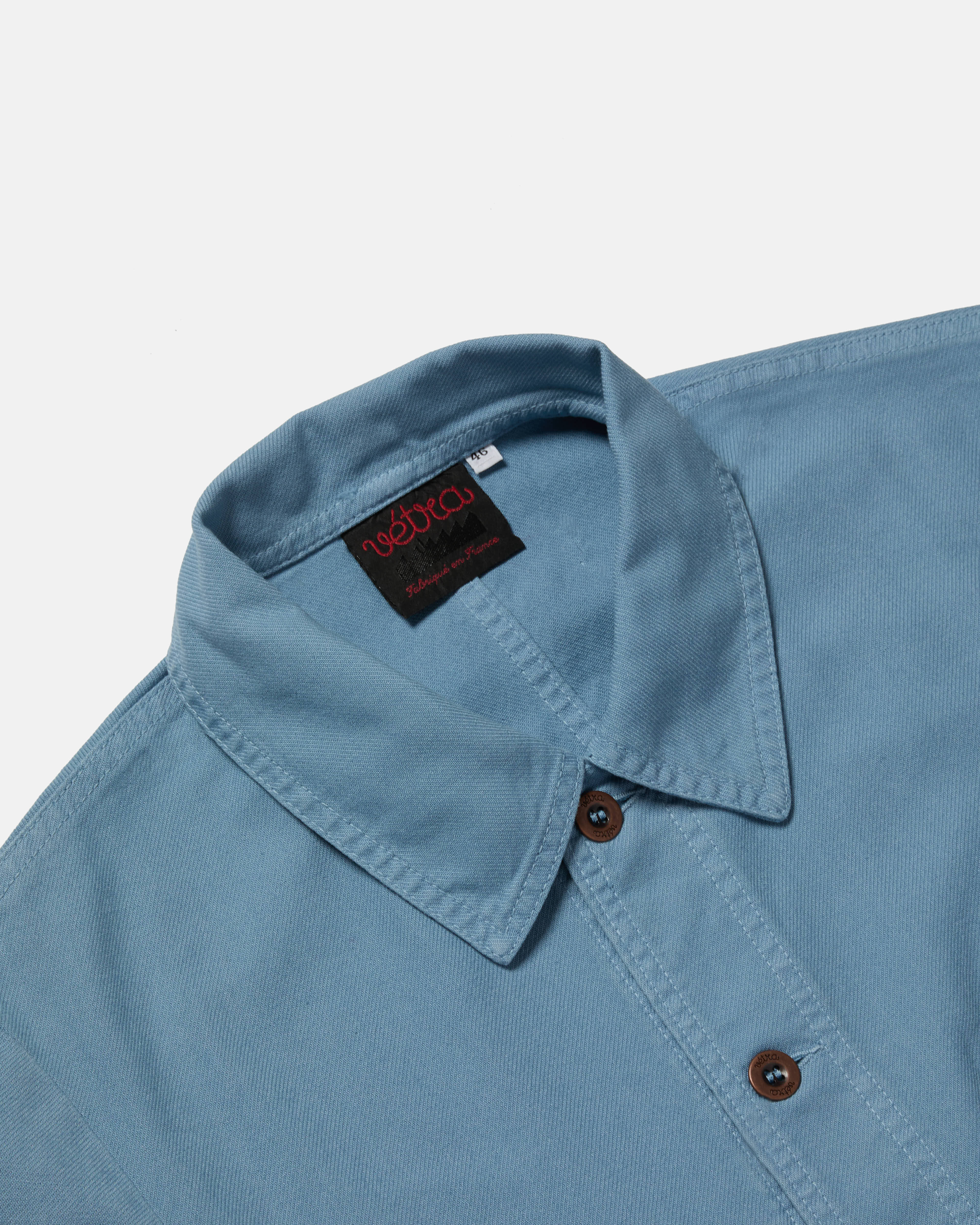 Close-up of button front on cloud Vetra cotton twill jacket