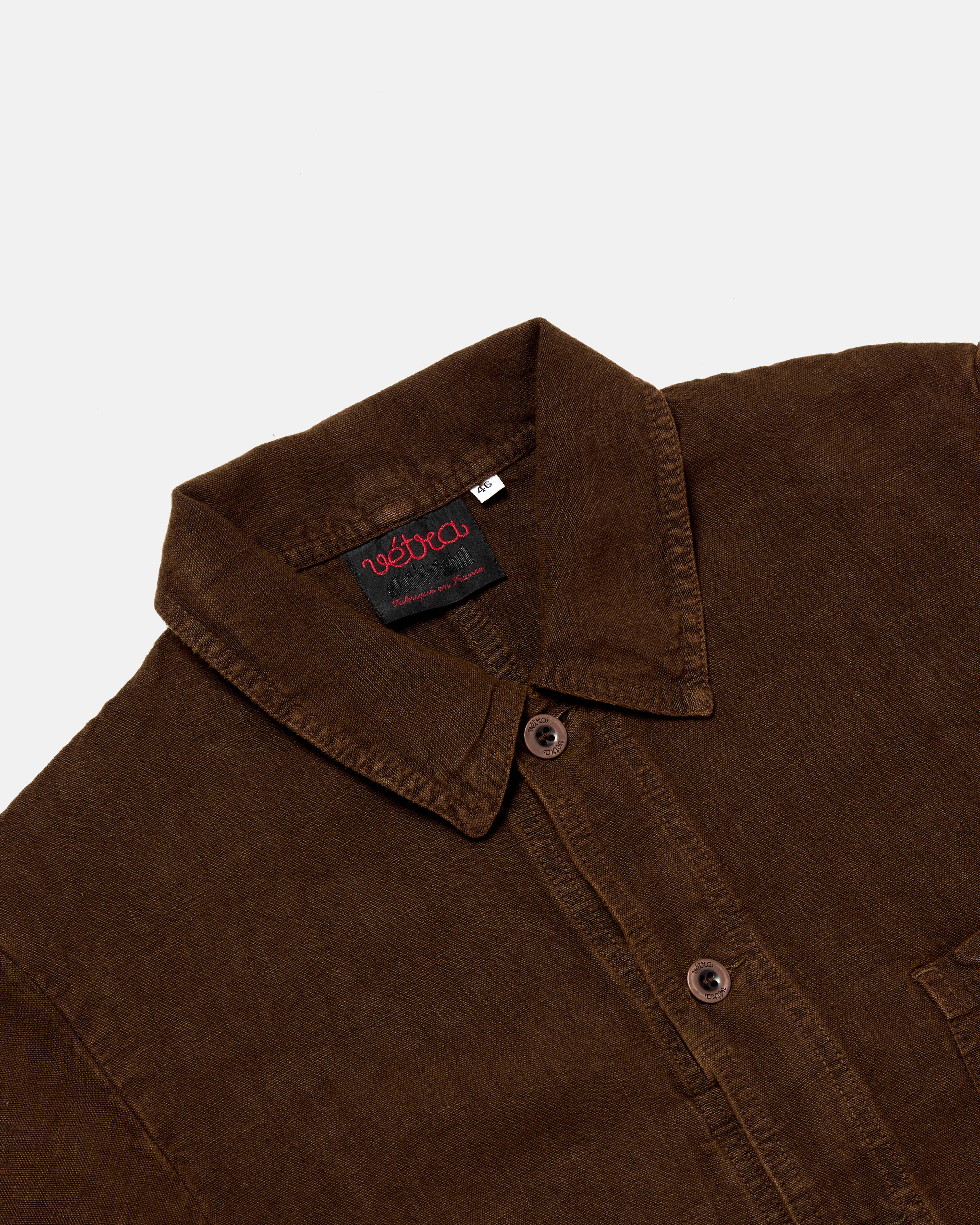Close-up of button front on datte Vetra heavy linen jacket