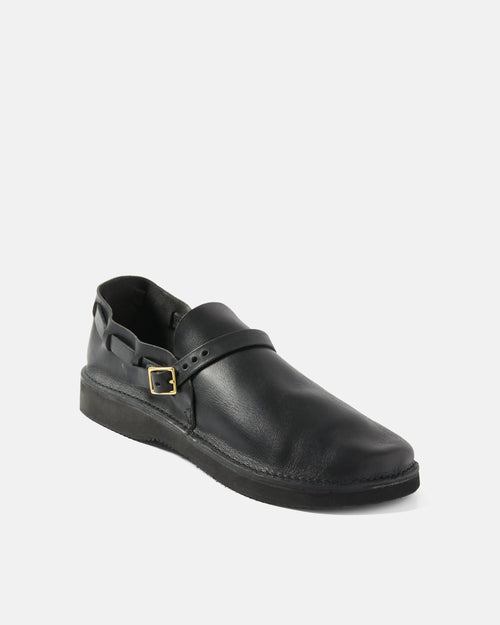 Angled view of black Aurora Middle English leather strap shoe