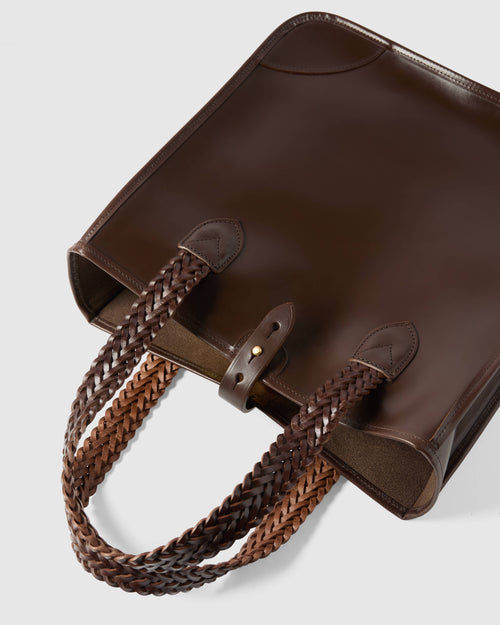 Close-up of hand-plaited leather handles on dark brown Beorma Bodleian tote bag