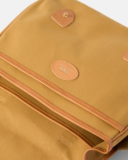 Open view of sandstone Beorma Morar messenger bag showing main compartment and pockets