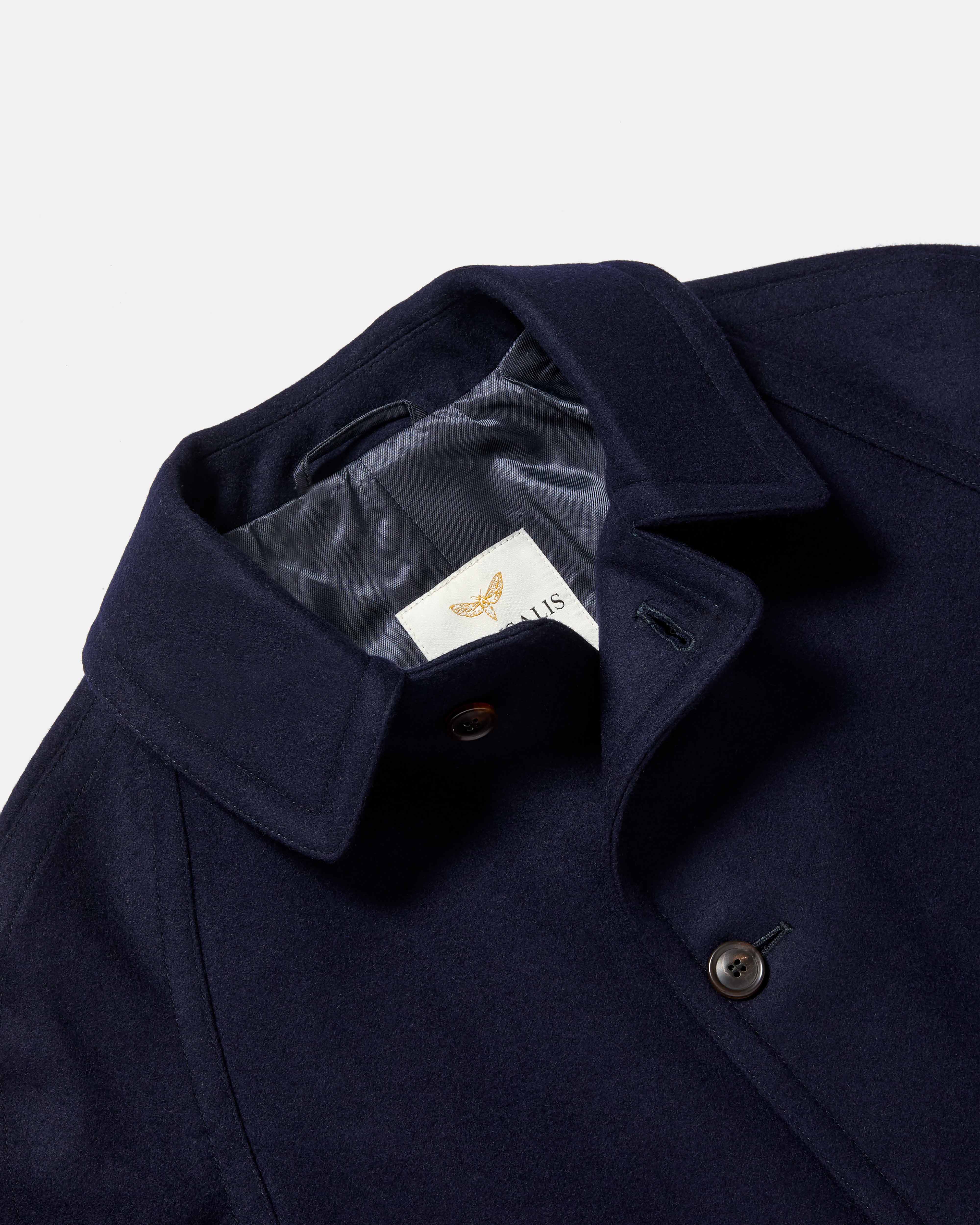 Close-up of collar detail on navy Chrysalis Kensington coat