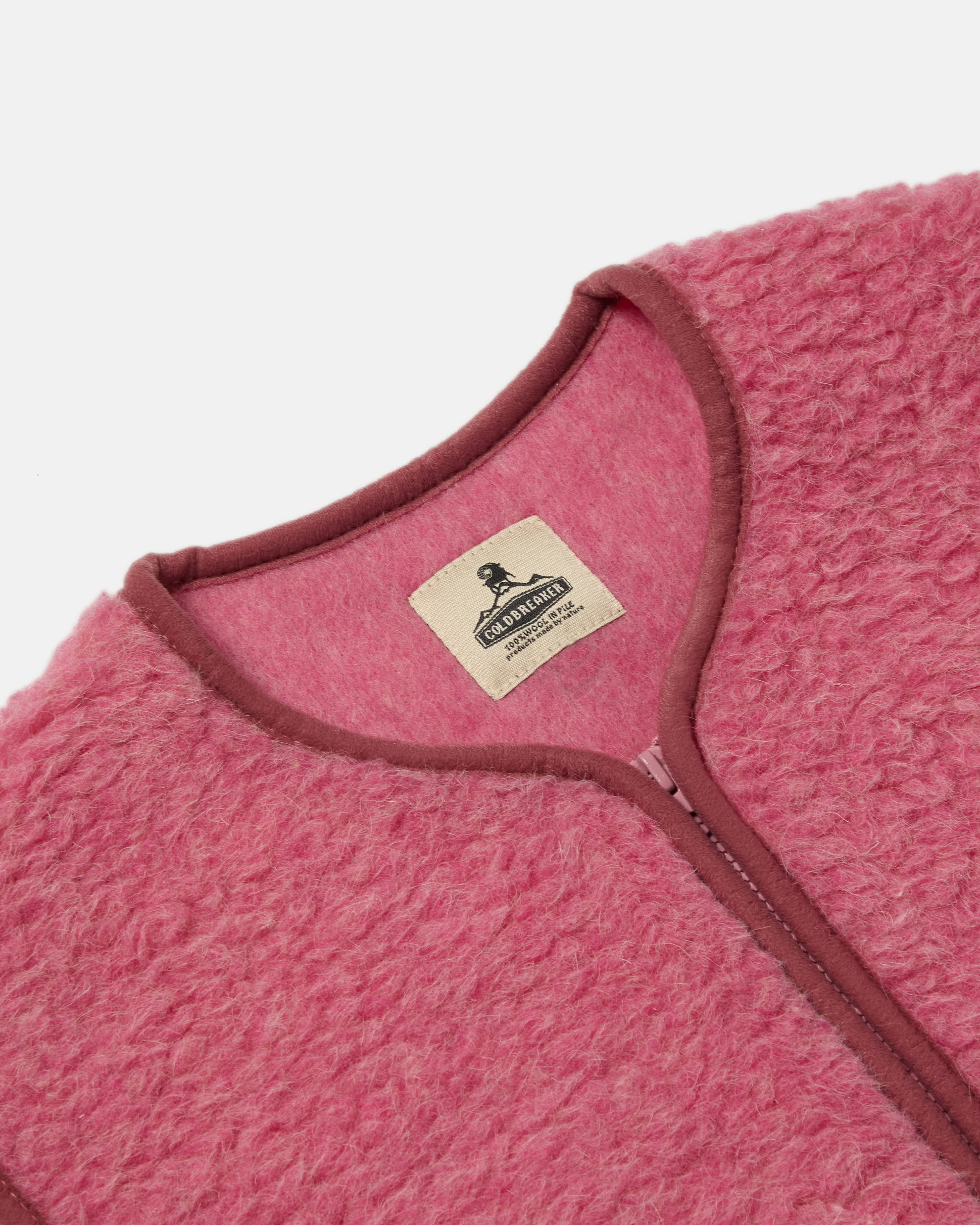Close-up of zip front on pink Coldbreaker Pepitco gilet