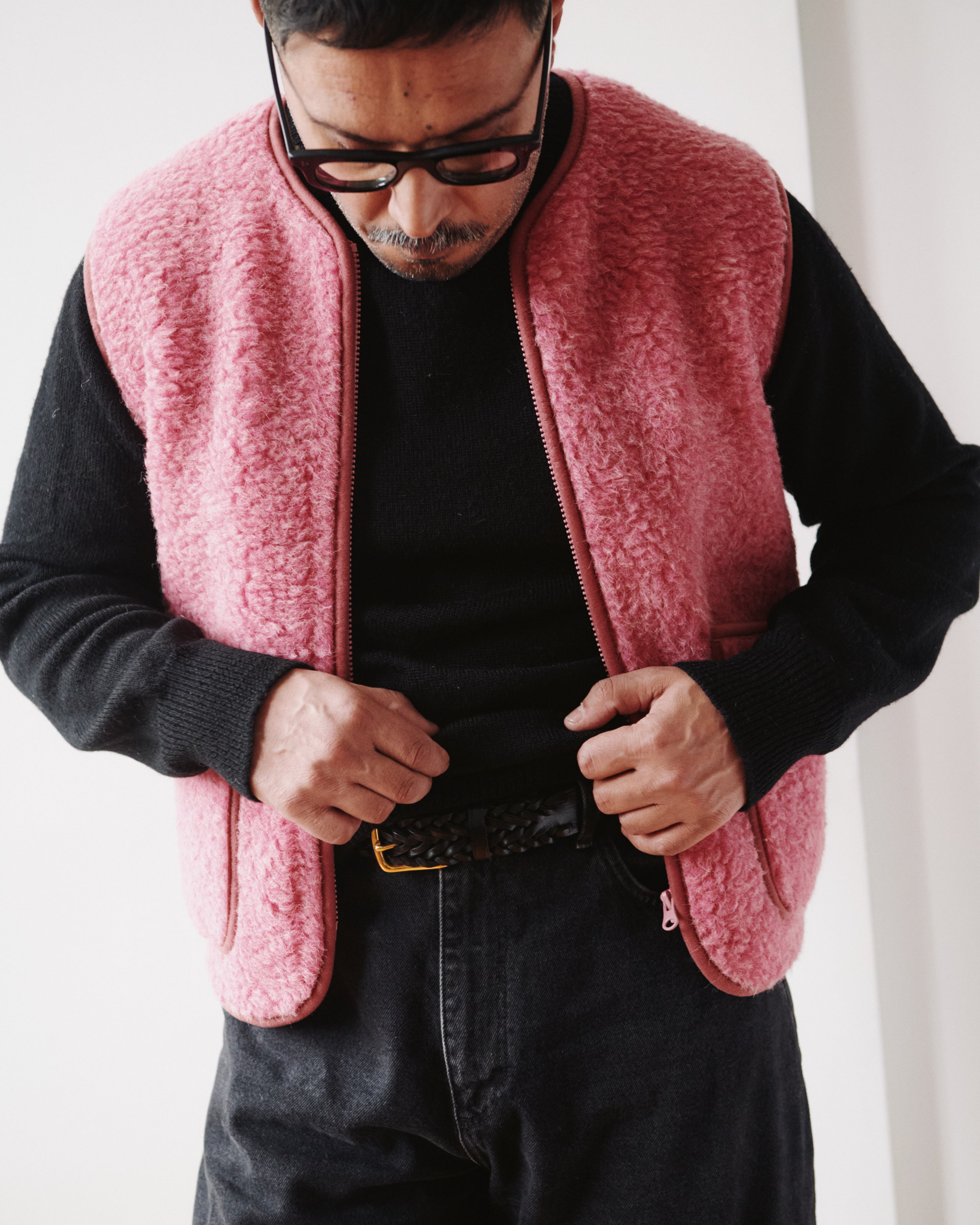 Lifestyle detail of Coldbreaker Pepitko pink wool gilet with Beorma plaited leather belt