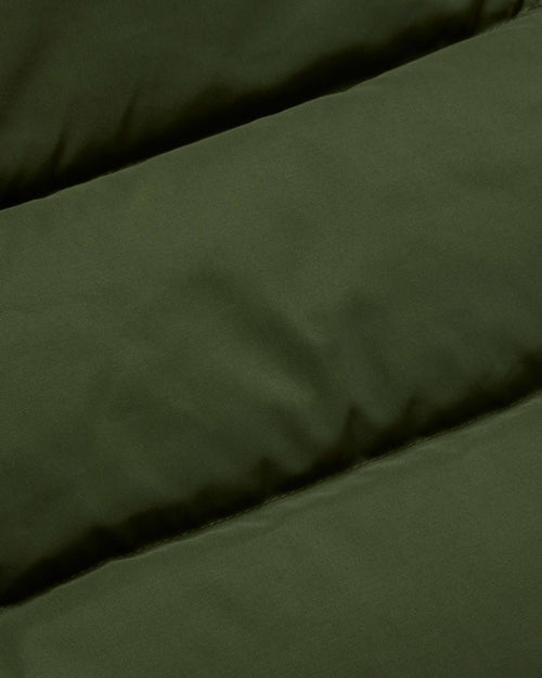 Close-up of cotton nylon fabric on olive Crescent down parka