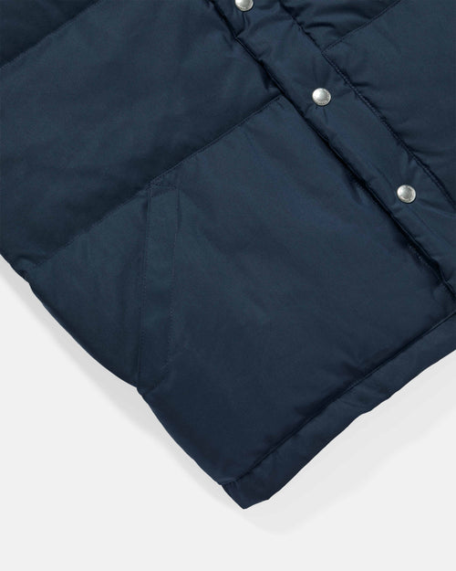 Close-up of pocket detail on navy Crescent down vest