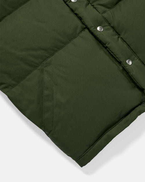 Close-up of pocket detail on olive Crescent down vest