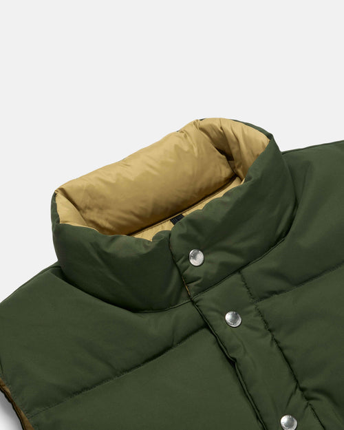 Close-up of snap front on olive Crescent cotton nylon vest