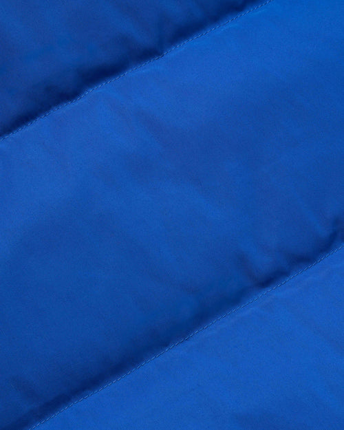 Close-up of cotton nylon fabric on royal blue Crescent down vest