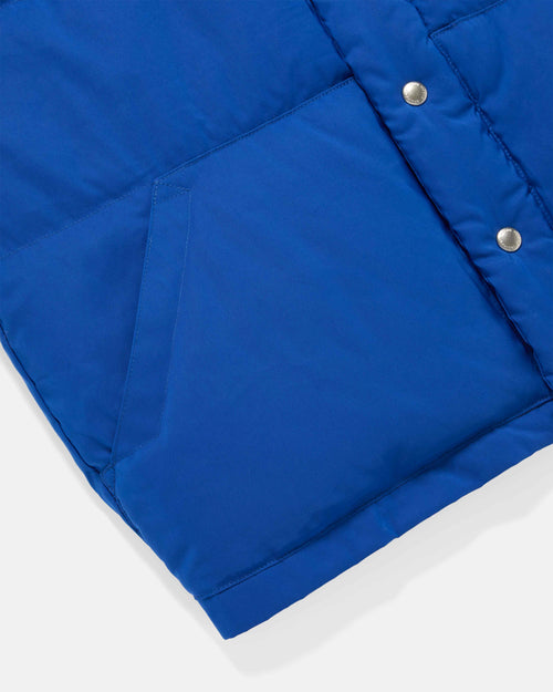 Close-up of pocket detail on royal blue Crescent down vest