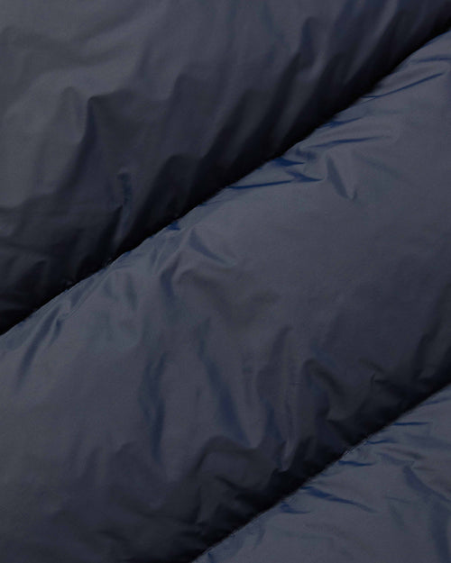 Close-up of nylon fabric on navy Crescent down vest