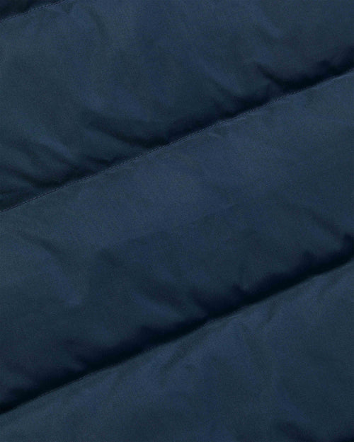 Close-up of navy nylon fabric on Crescent down vest