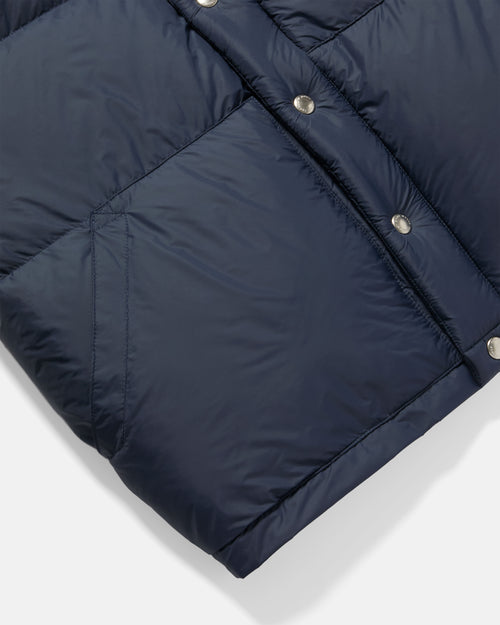 Close-up of pocket detail on navy Crescent down vest