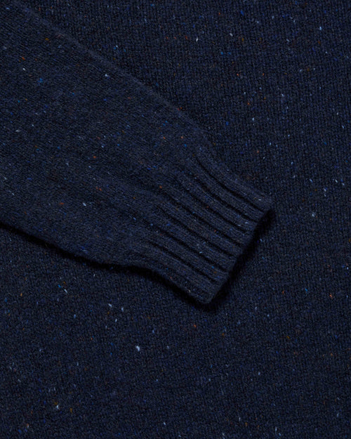 Close-up of ribbed cuff detail on navy Harley Donegal Crew Neck