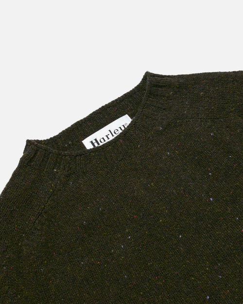 Close-up of crew neck collar detail on olive Harley Donegal Crew Neck