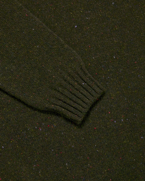 Close-up of ribbed cuff detail on olive Harley Donegal Crew Neck