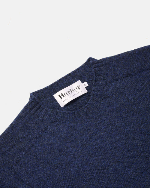 Close-up of crew neck collar detail on navy Harley Superfine Lambswool Crew Neck