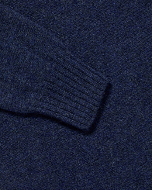 Close-up of ribbed cuff detail on navy Harley Superfine Lambswool Polo
