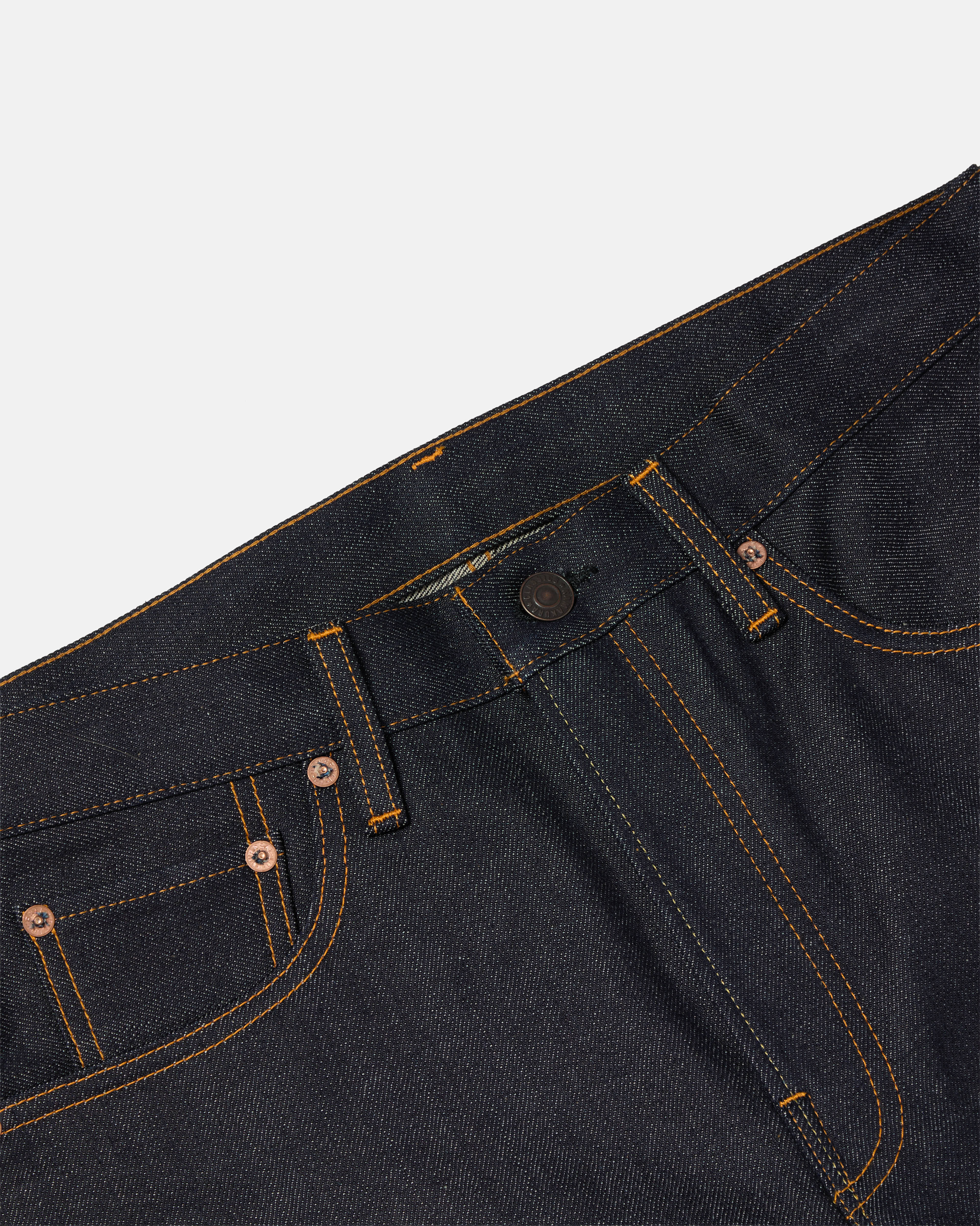 Close-up of waistband and button closure on blue Kamakura Take Ivy selvedge jeans