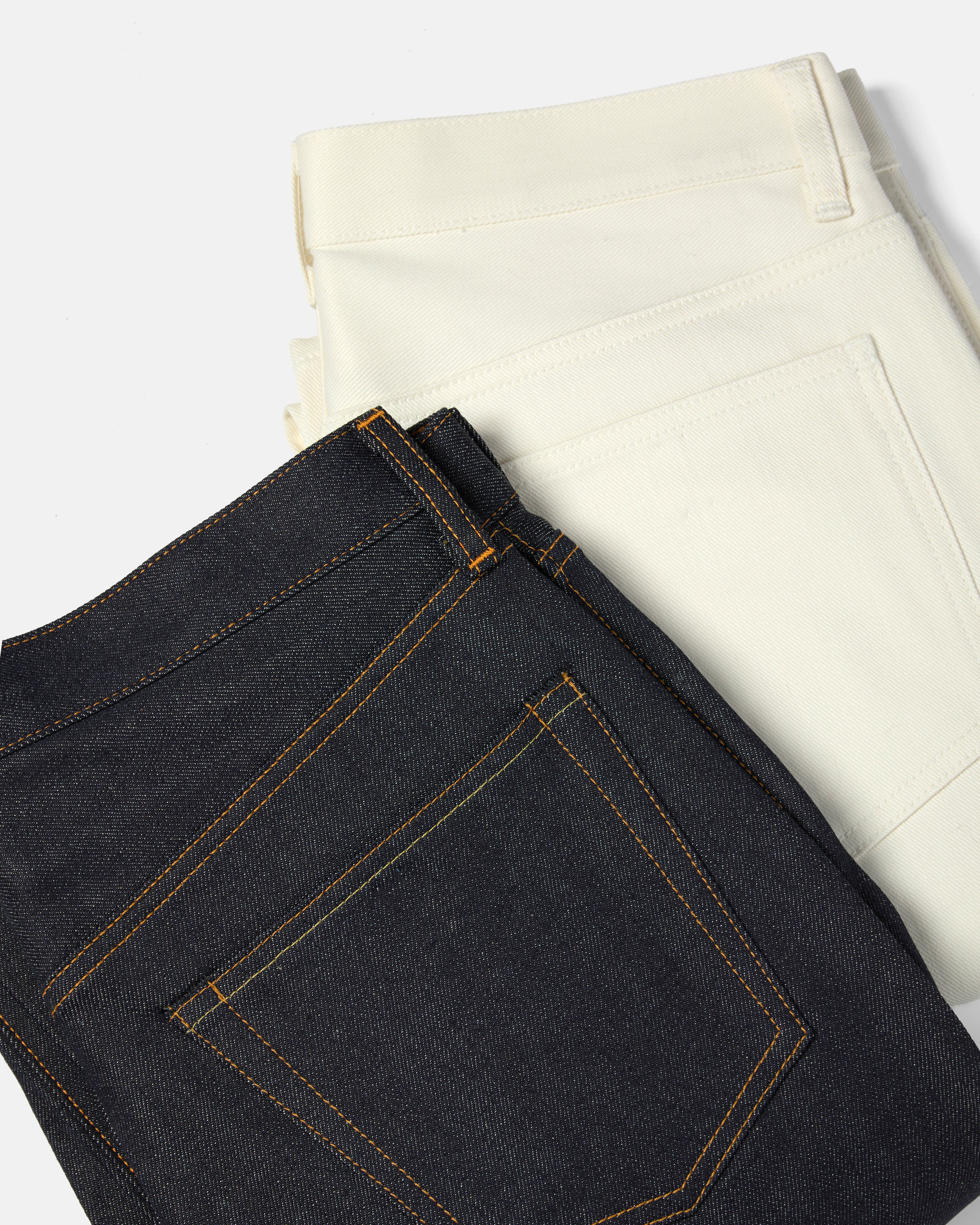 Flat lay of Kamakura Vintage Ivy 5 pocket jeans in denim and ecru