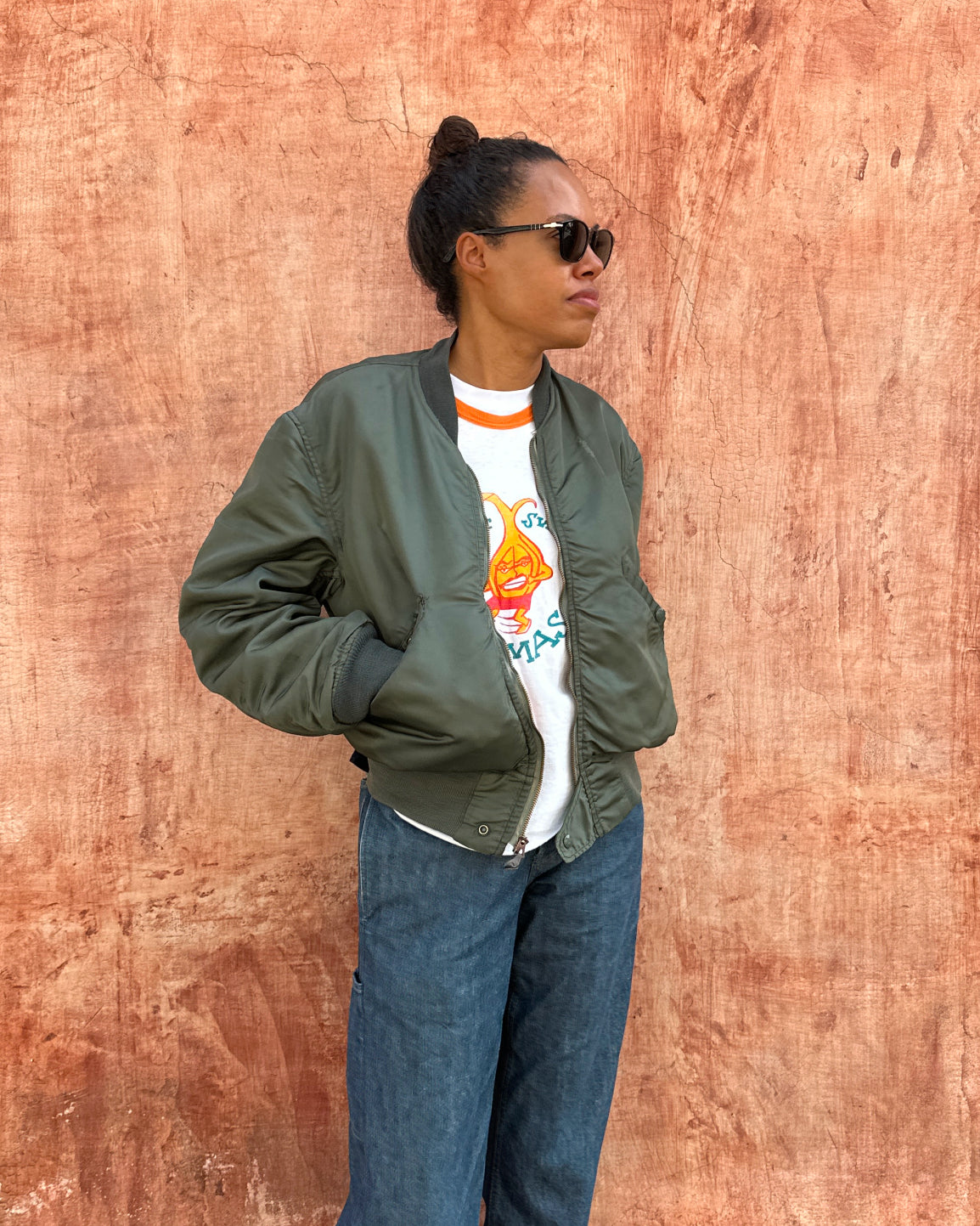 Lifestyle view of Lena Dystant wearing A2 bomber jacket in the Something Old Something New series