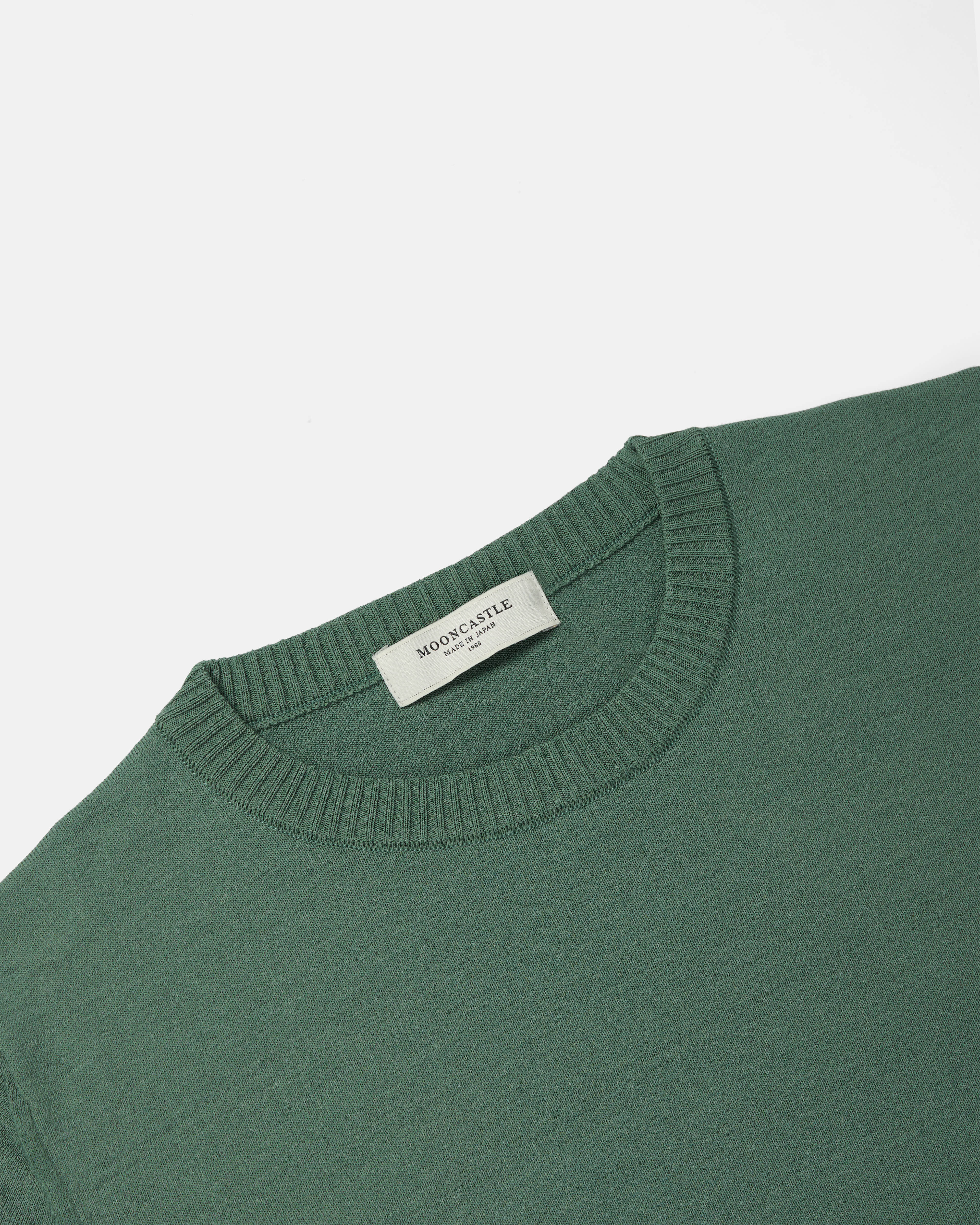Close-up of crewneck collar on olive Mooncastle Ice Cotton tee