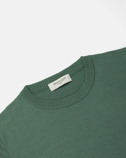 Close-up of crewneck collar on olive Mooncastle Ice Cotton tee