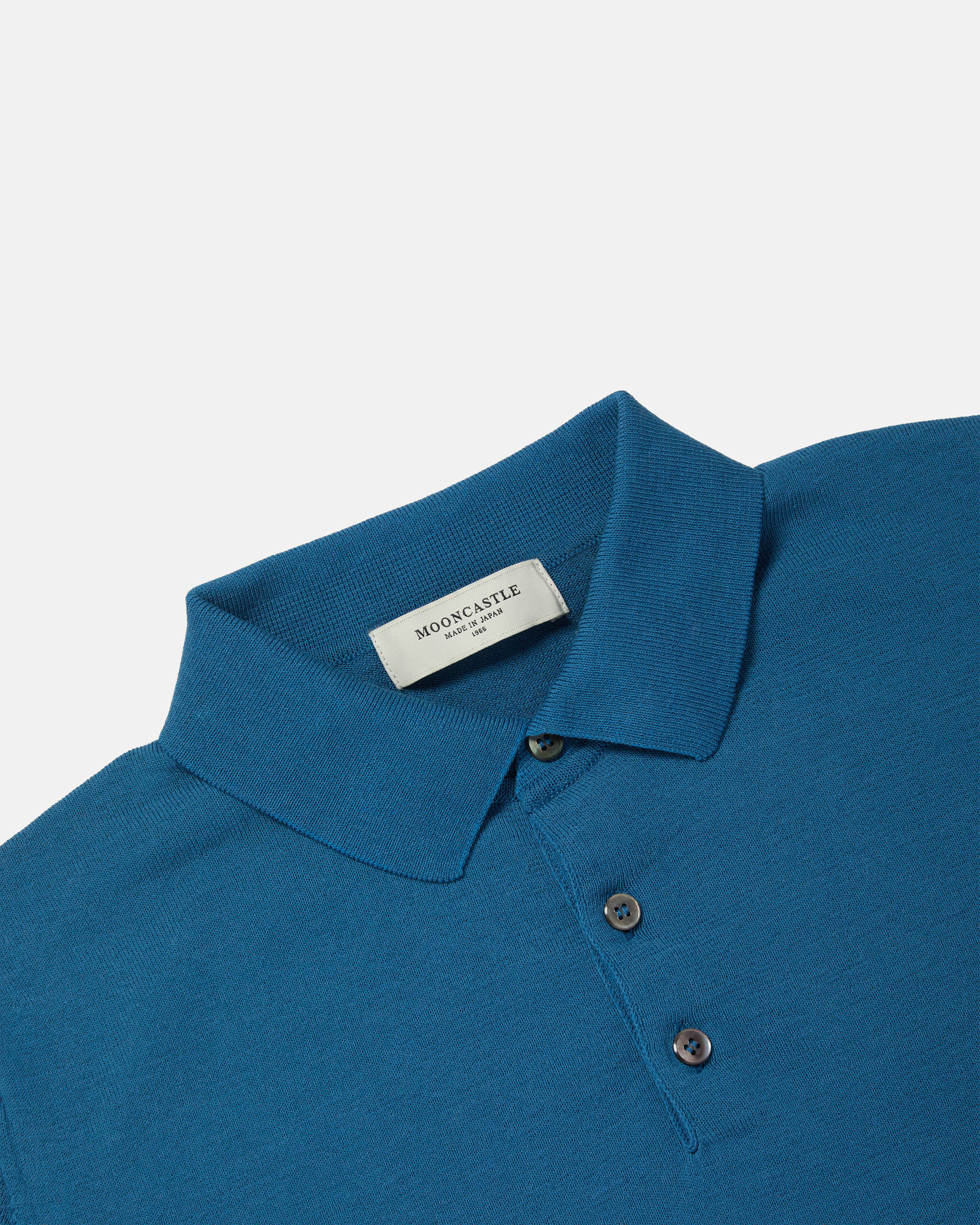 Close-up of collar and placket on blue Mooncastle Ice Cotton knit polo shirt