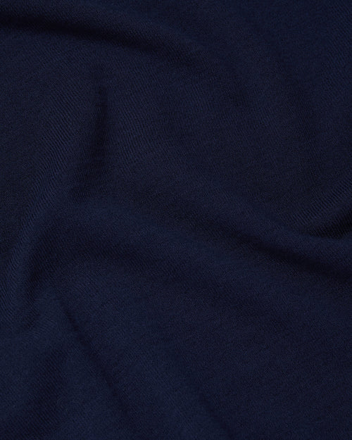 Close-up of Ice Cotton knit fabric on navy Mooncastle polo shirt