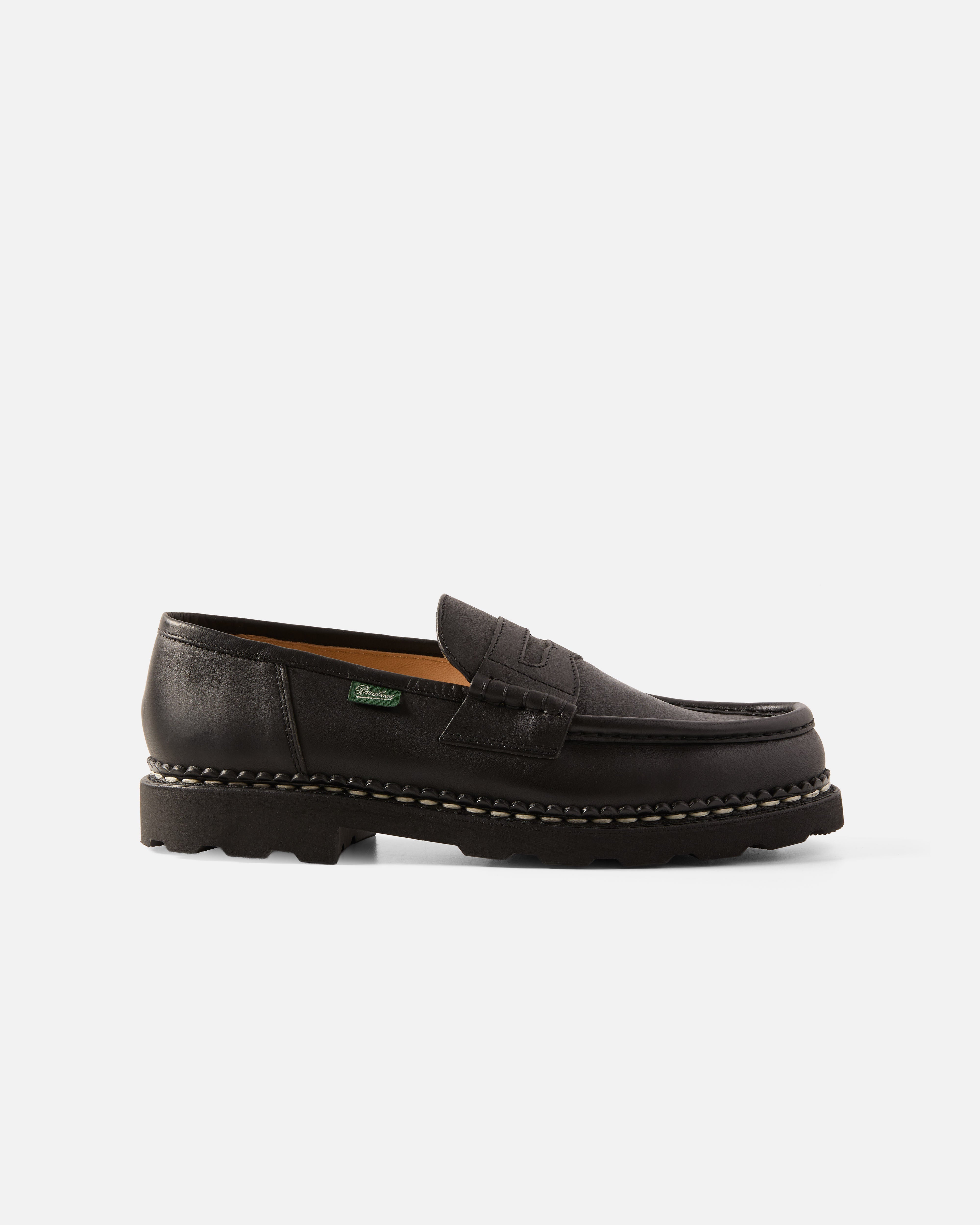 Side view of black Paraboot Reims leather penny loafer