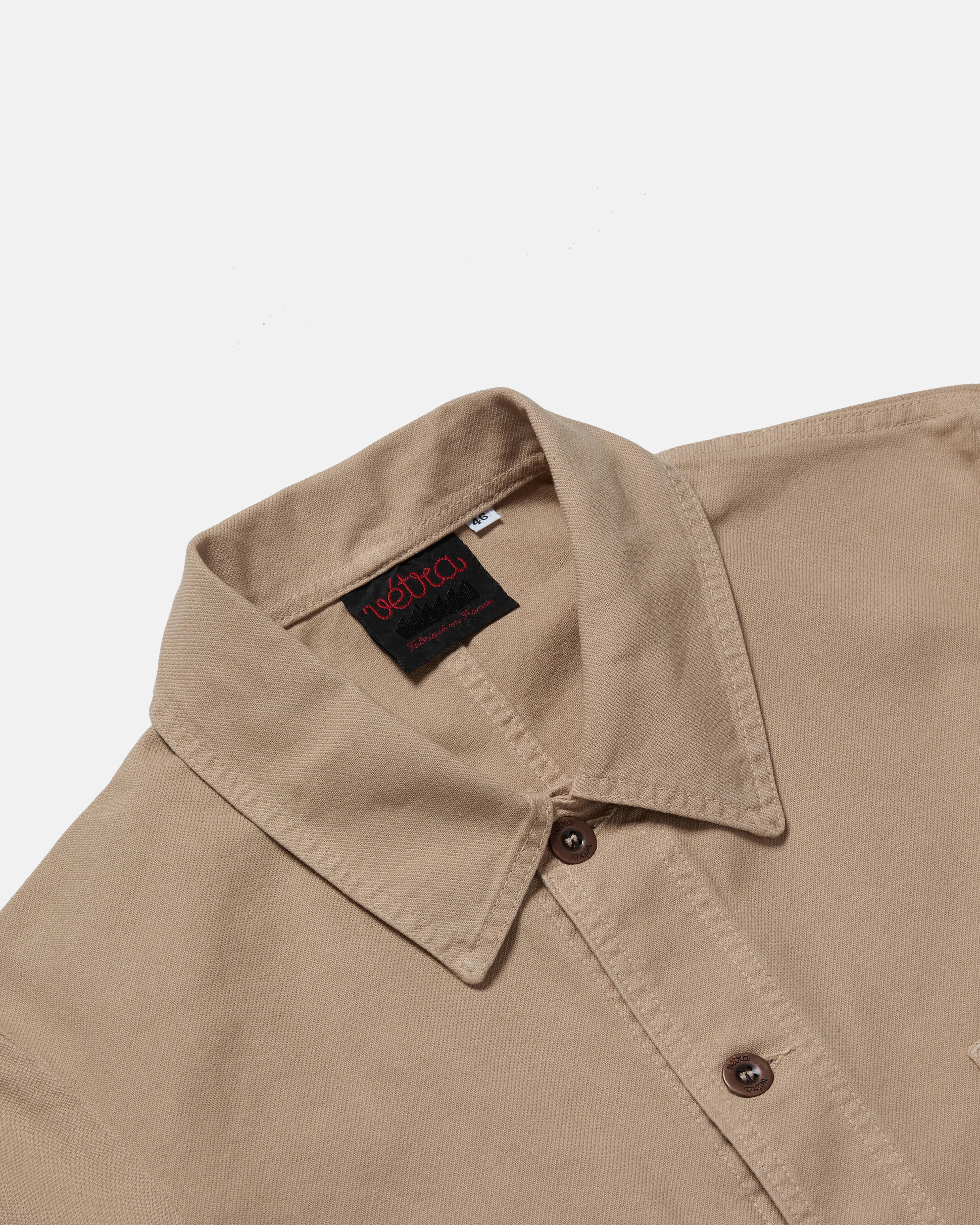 Close-up of button front on chalk Vetra cotton twill jacket