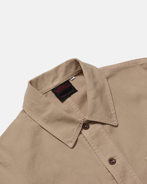 Close-up of button front on chalk Vetra cotton twill jacket