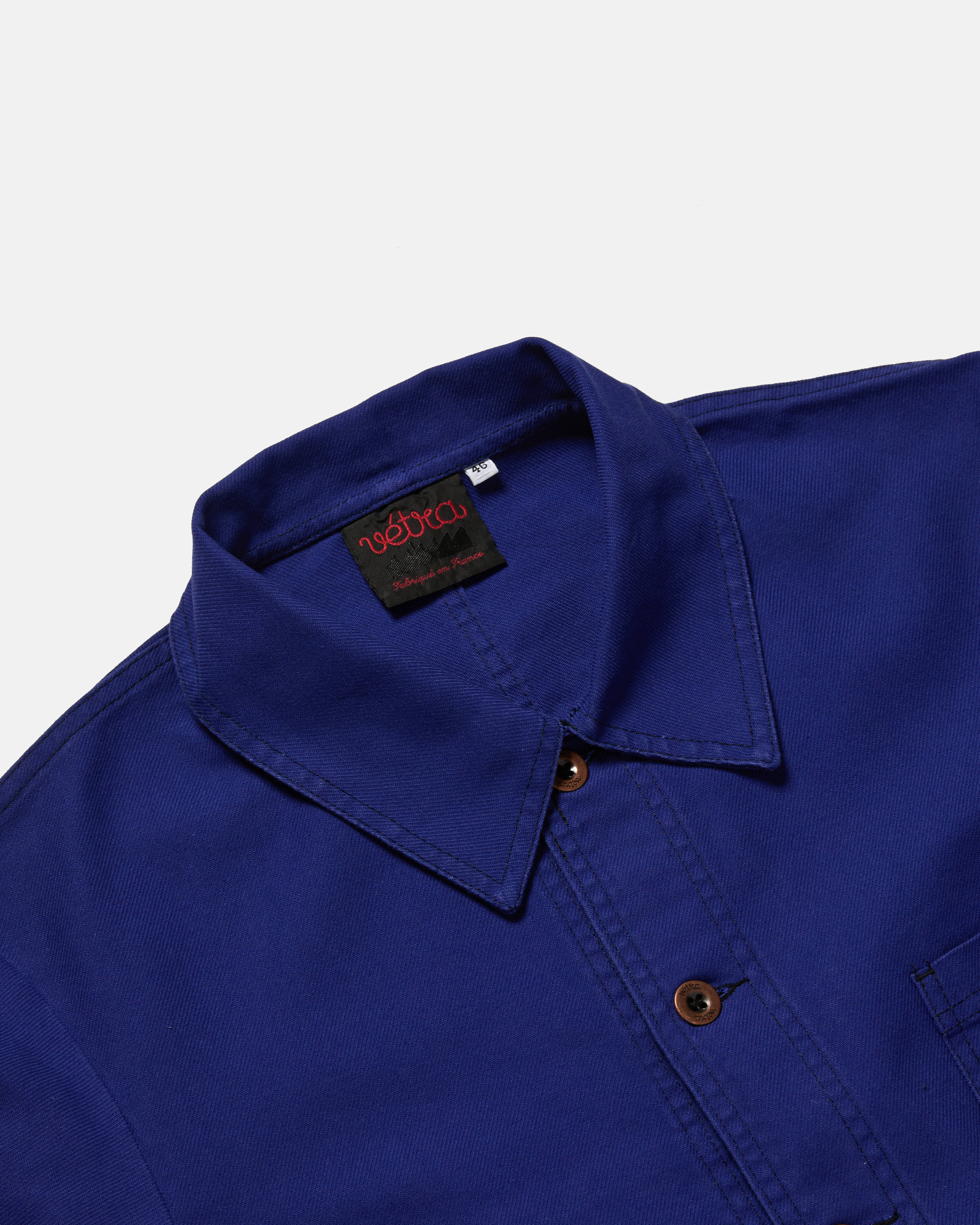 Close-up of button front on hydrone blue Vetra cotton twill jacket
