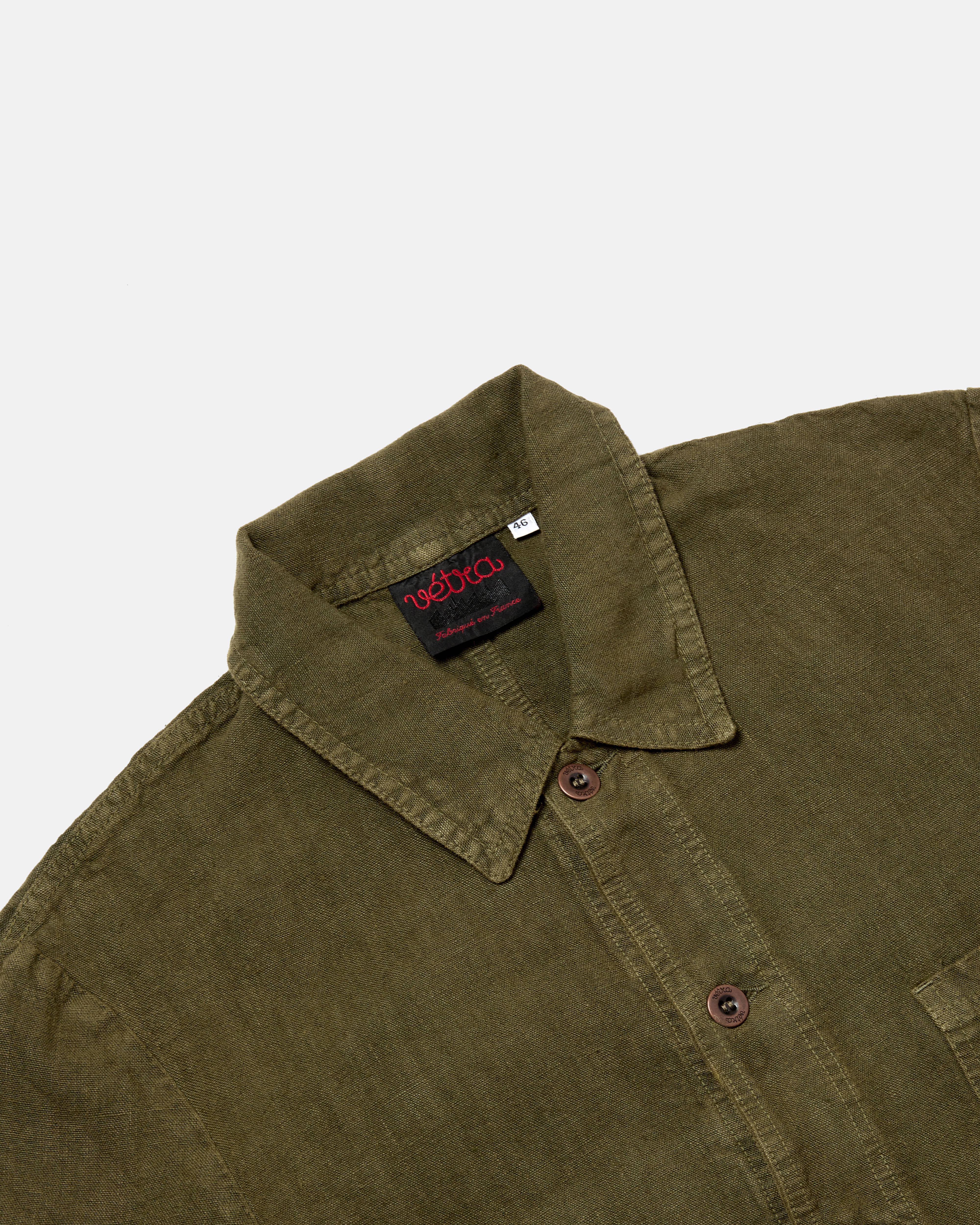 Close-up of button front on olive Vetra heavy linen jacket