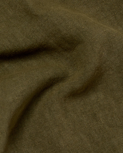 Close-up of heavyweight linen fabric on olive Vetra chore jacket