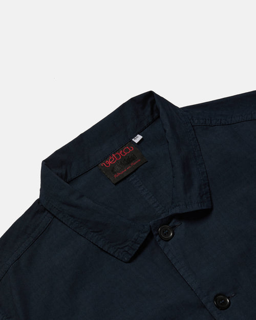 Close-up of button front on navy Vetra ripstop jacket