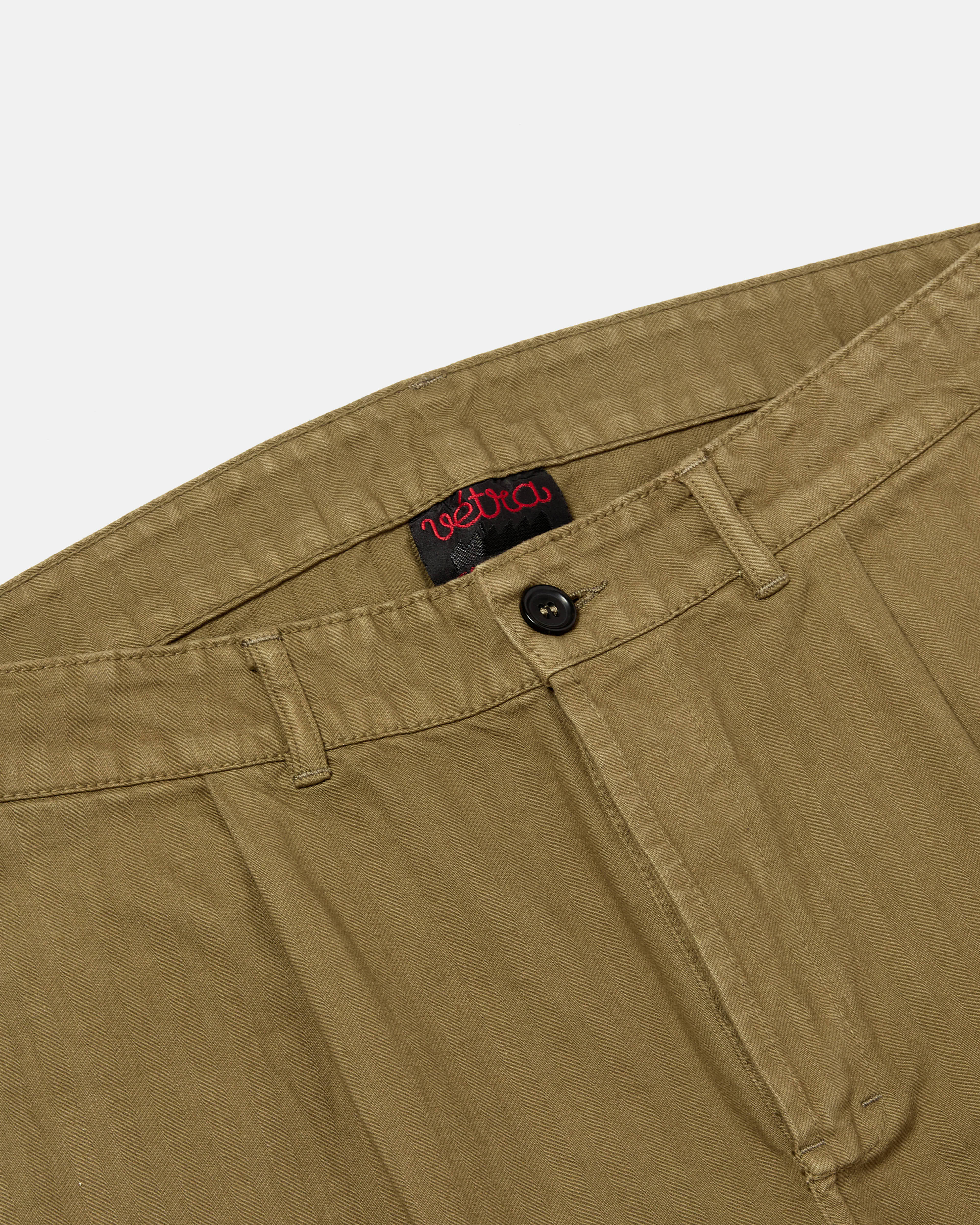 Close-up of waistband and button closure on olive Vetra workwear trousers