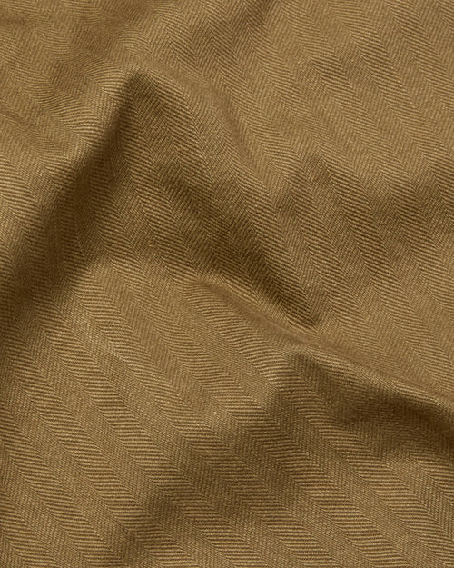 Close-up of herringbone cotton fabric on olive Vetra workwear blazer